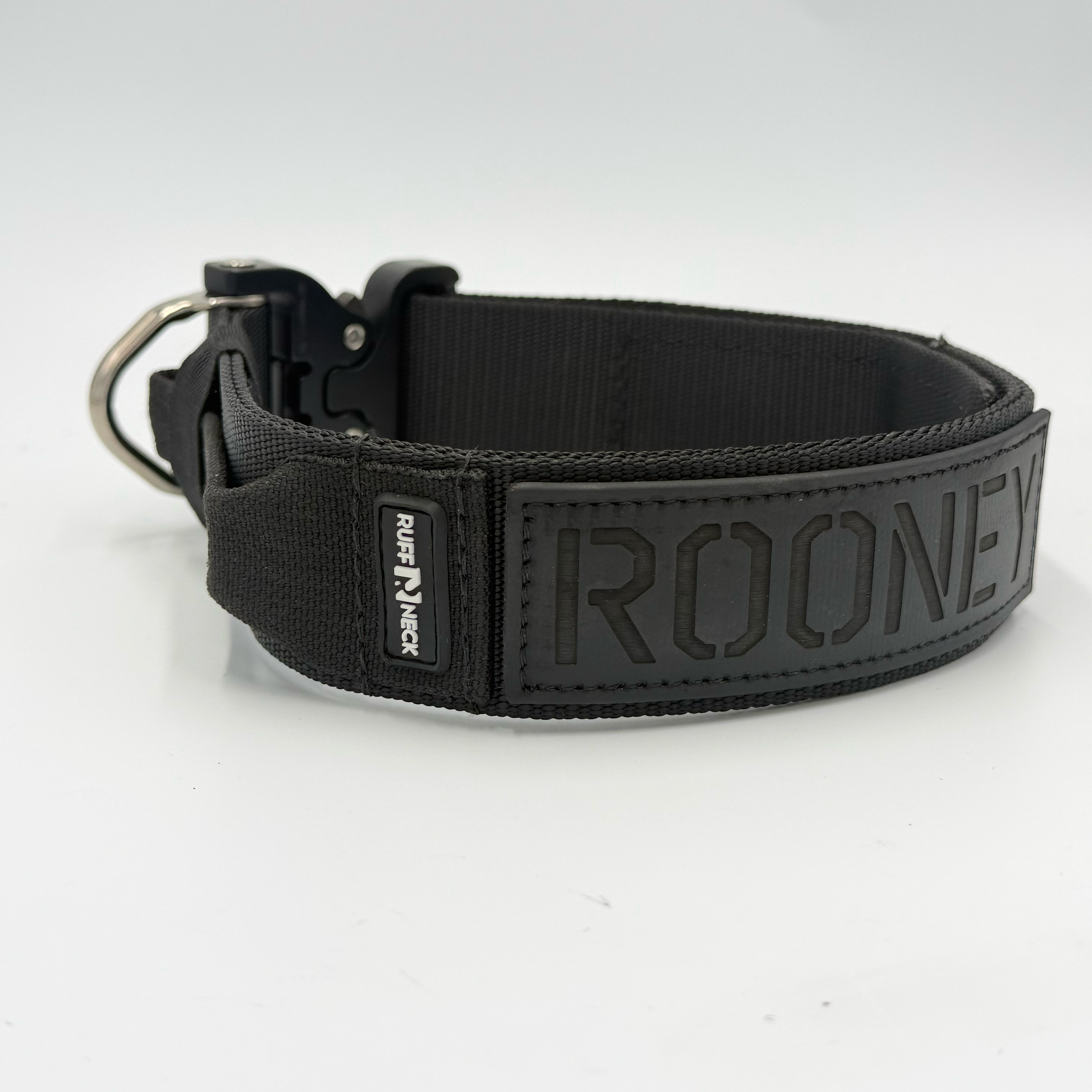 Titan Tactical Elite Dog Collar featuring 1.75" Mil-Spec Type 13 nylon webbing, a genuine AustriAlpin COBRA® Integrated D-Ring Buckle, RuffLock Retained Handle System, and the exclusive RuffTag Personalized BioThane Identification System. Handmade in the USA by American Ruffneck Collars. Side view