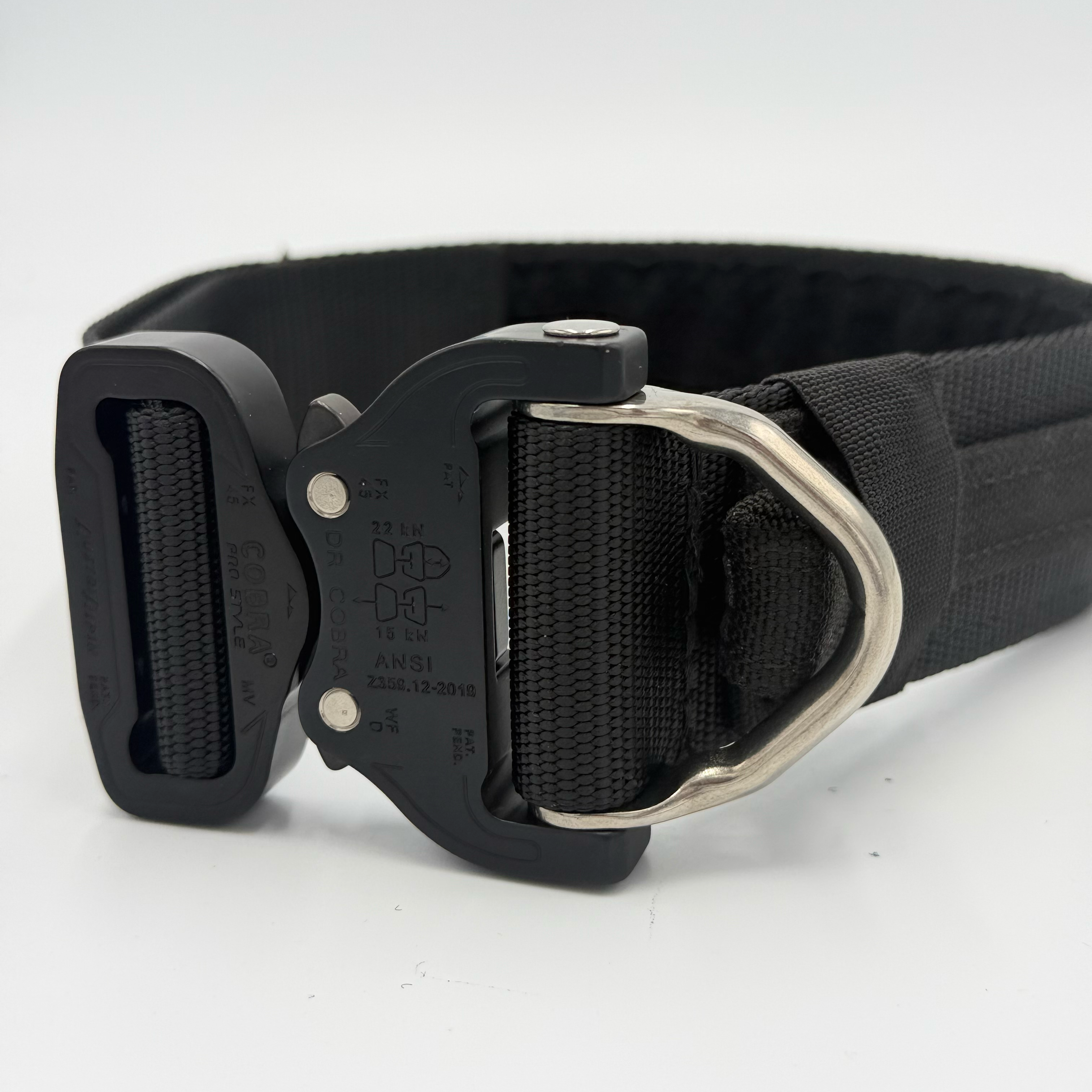 Titan Tactical Elite Dog Collar featuring 1.75" Mil-Spec Type 13 nylon webbing, a genuine AustriAlpin COBRA® Integrated D-Ring Buckle, RuffLock Retained Handle System, and the exclusive RuffTag Personalized BioThane Identification System. Handmade in the USA by American Ruffneck Collars. Buckle close-up.