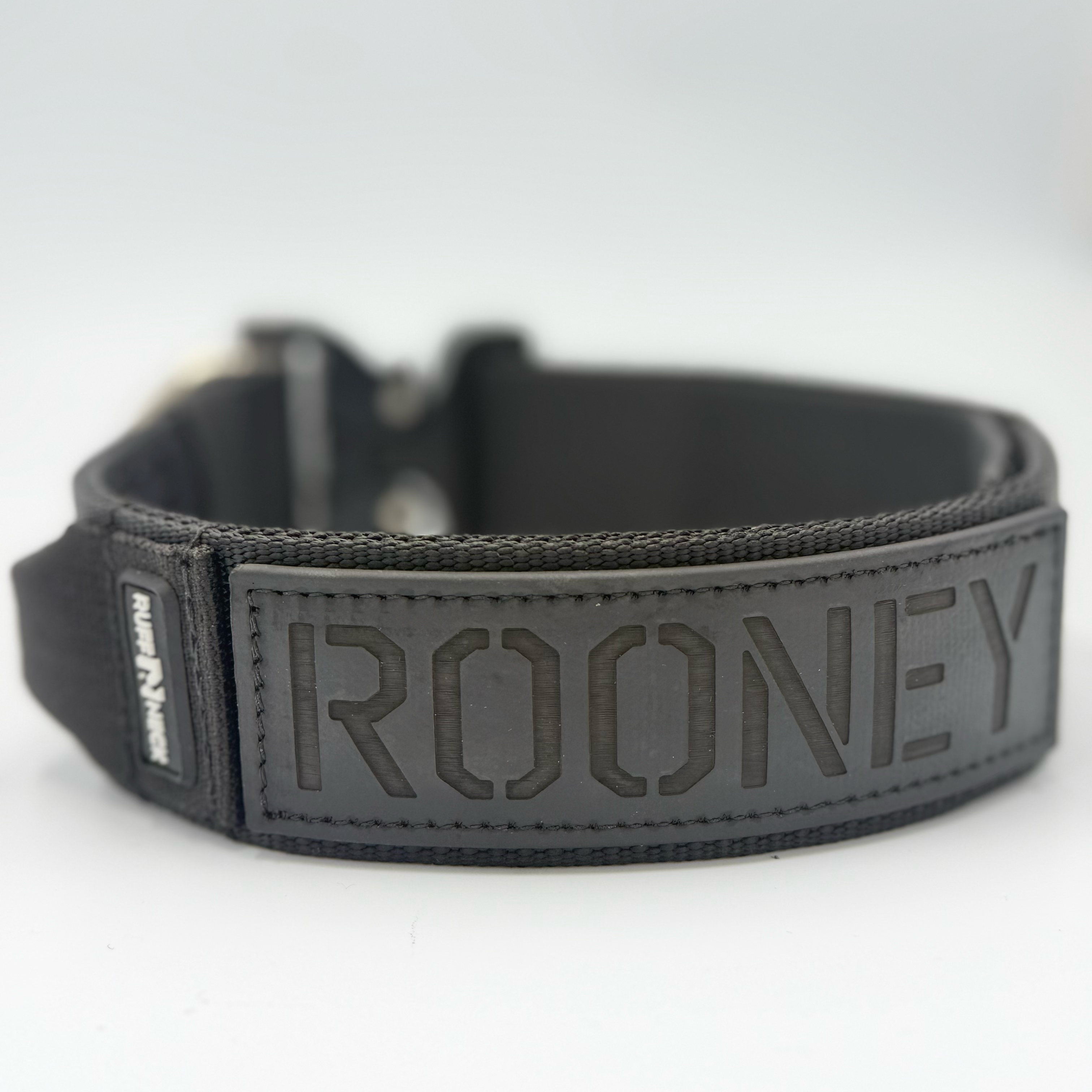 Titan Tactical Elite Dog Collar featuring 1.75" Mil-Spec Type 13 nylon webbing, a genuine AustriAlpin COBRA® Integrated D-Ring Buckle, RuffLock Retained Handle System, and the exclusive RuffTag Personalized BioThane Identification System. Handmade in the USA by American Ruffneck Collars. Biothane view.