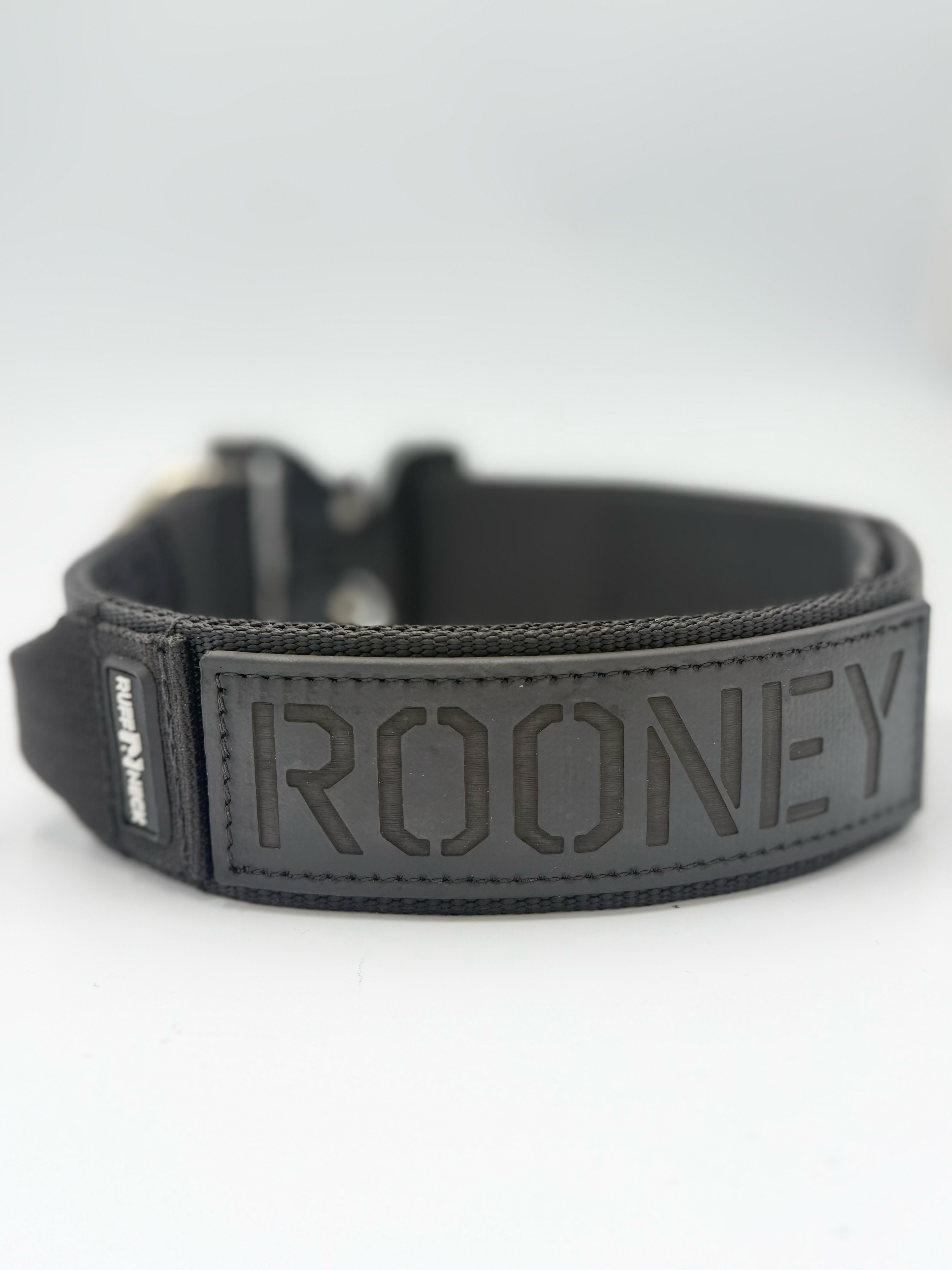 Titan Tactical Elite Dog Collar featuring 1.75" Mil-Spec Type 13 nylon webbing, a genuine AustriAlpin COBRA® Integrated D-Ring Buckle, RuffLock Retained Handle System, and the exclusive RuffTag Personalized BioThane Identification System. Handmade in the USA by American Ruffneck Collars. Biothane view.