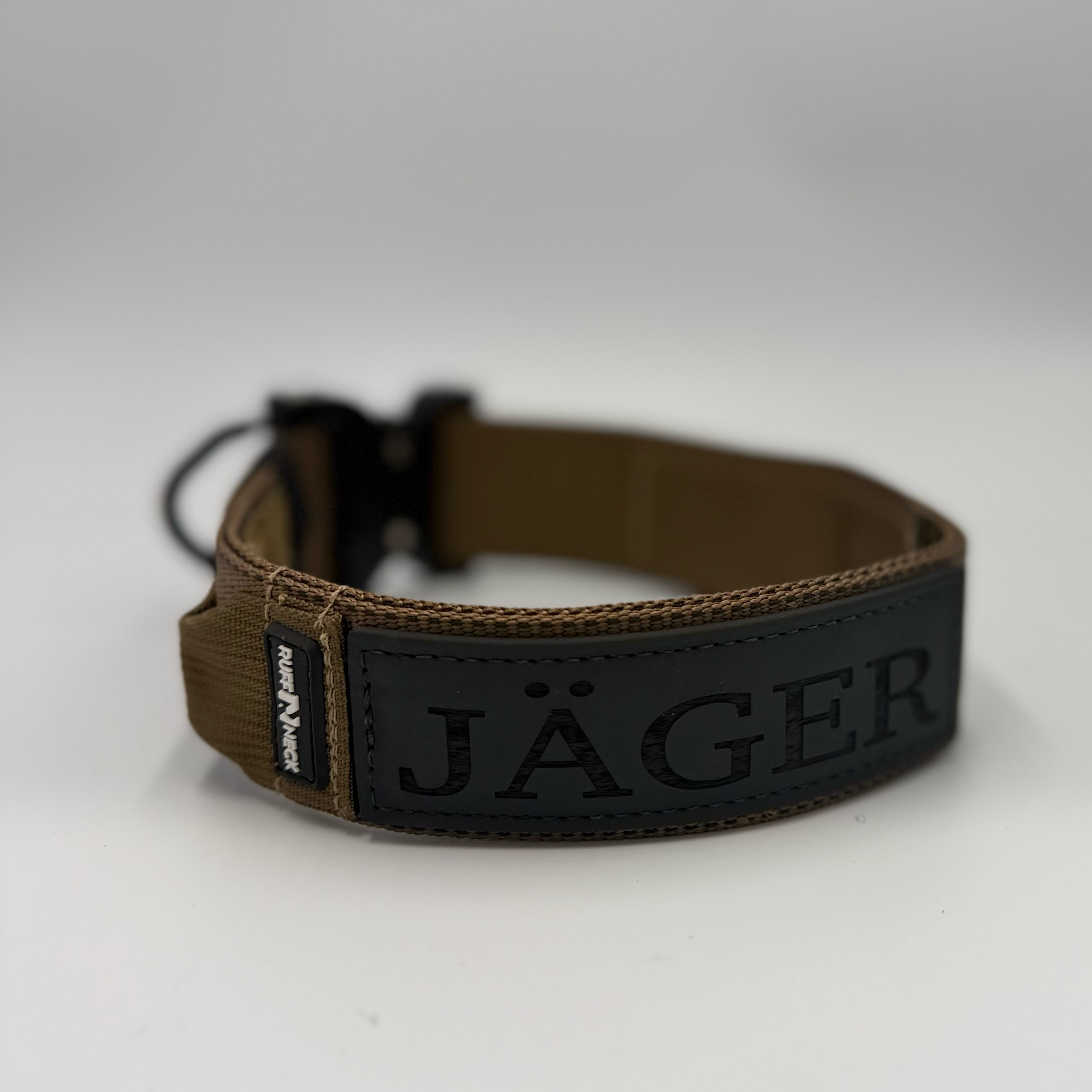 Titan Tactical Elite Dog Collar featuring 1.75" Mil-Spec Type 13 nylon webbing, a genuine AustriAlpin COBRA® Integrated D-Ring Buckle, RuffLock Retained Handle System, and the exclusive RuffTag Personalized BioThane Identification System. Handmade in the USA by American Ruffneck Collars. Clean level rear view of Rufftag.