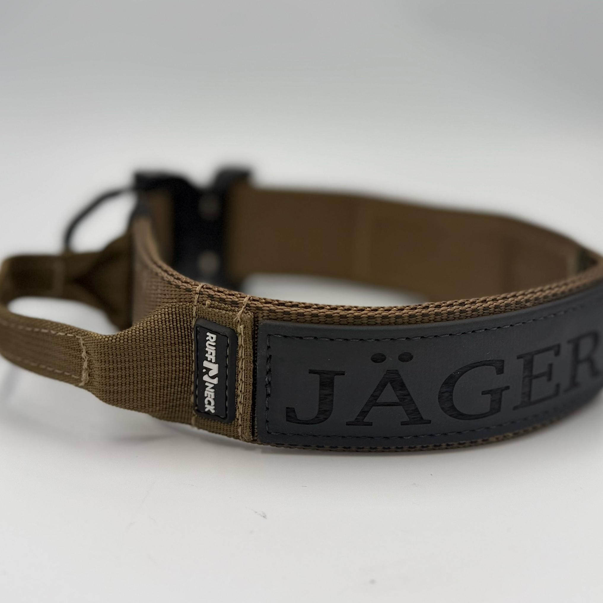 Titan Tactical Elite Dog Collar featuring 1.75" Mil-Spec Type 13 nylon webbing, a genuine AustriAlpin COBRA® Integrated D-Ring Buckle, RuffLock Retained Handle System, and the exclusive RuffTag Personalized BioThane Identification System. Handmade in the USA by American Ruffneck Collars.