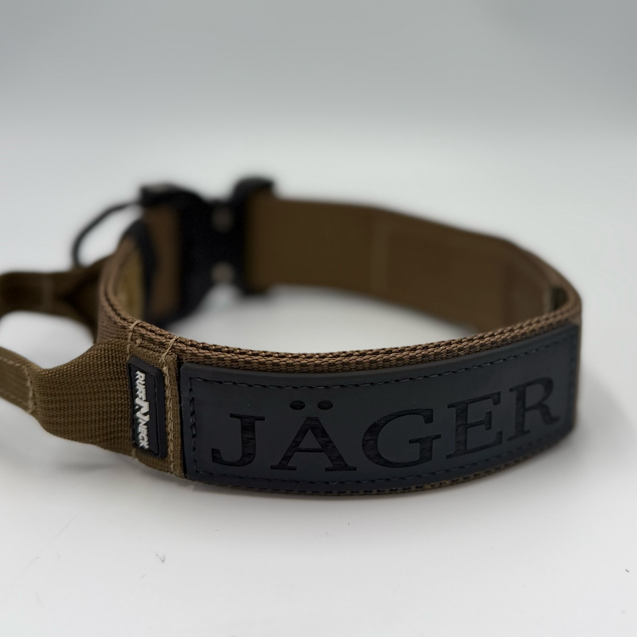 Titan Tactical Elite Dog Collar featuring 1.75" Mil-Spec Type 13 nylon webbing, a genuine AustriAlpin COBRA® Integrated D-Ring Buckle, RuffLock Retained Handle System, and the exclusive RuffTag Personalized BioThane Identification System. Handmade in the USA by American Ruffneck Collars. Rear view with deployed handle.