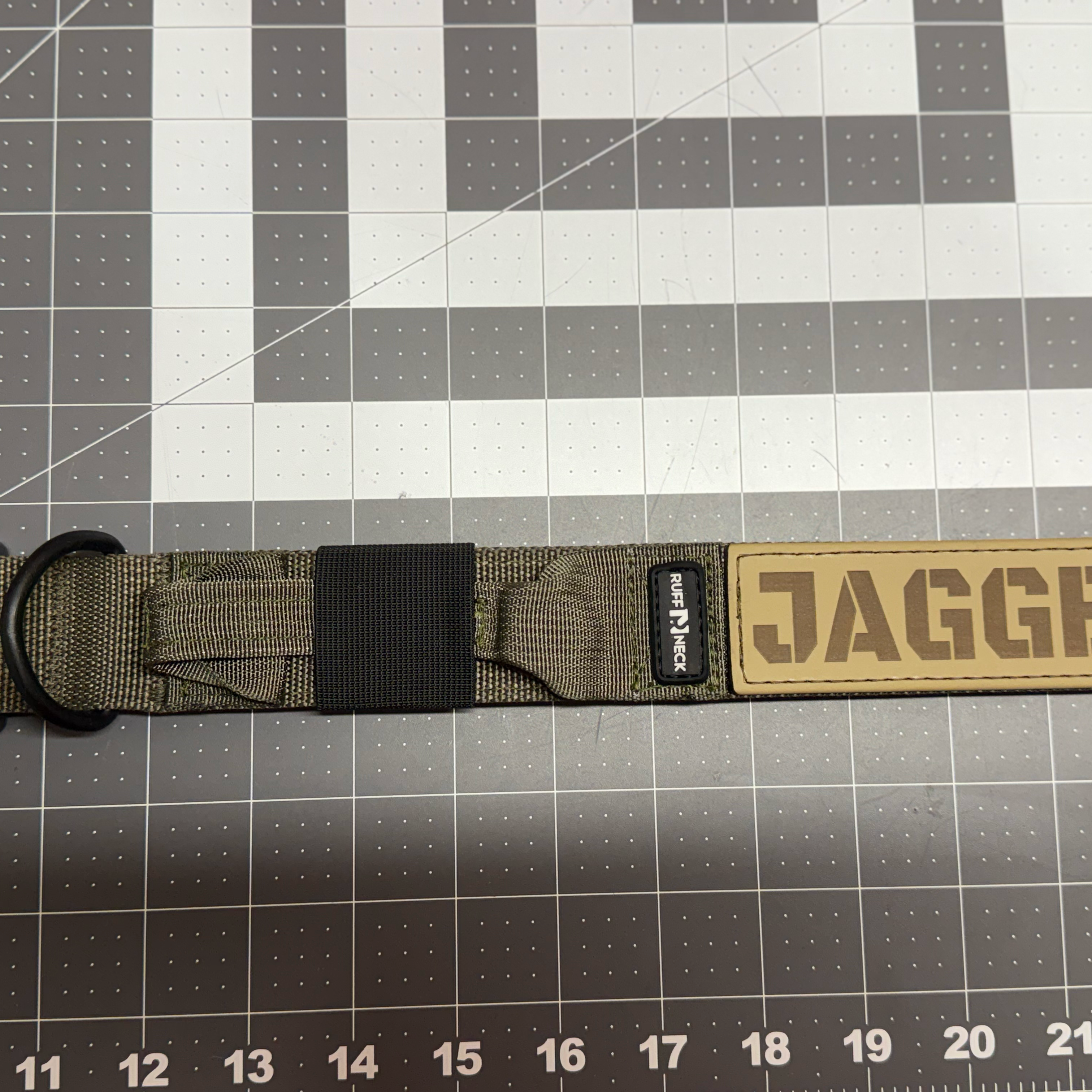 Titan Tactical Dog Collar featuring 1.5" Mil-Spec 4015 nylon webbing, a genuine AustriAlpin COBRA® buckle, RuffLock Retained Handle System, and the exclusive RuffTag Personalized BioThane Identification System. Handmade in the USA by American Ruffneck Collars. Opened up, lying flat.