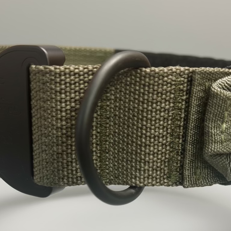 American Ruffneck Collars Titan Tactical Collar with durable nylon straps and metal buckle on a black background. Featuring the RuffLock Retained Handle System.