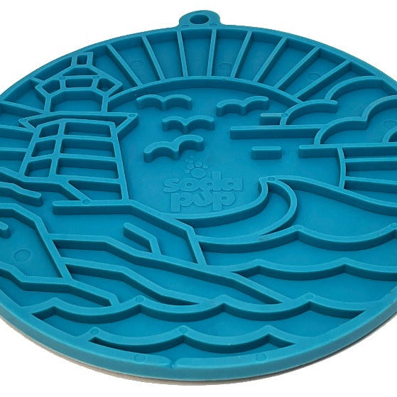 Sea foam blue Lighthouse eMat Enrichment Lick Mat with suction cups from SodaPup/True Dogs, LLC, designed for dog enrichment and bonding.