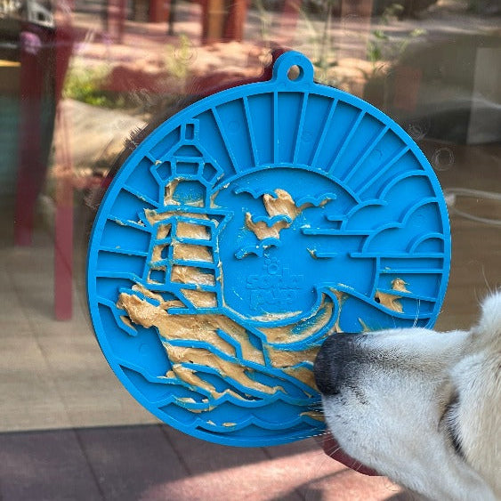 Sea foam blue Lighthouse eMat Enrichment Lick Mat with suction cups from SodaPup/True Dogs, designed for dog enrichment.