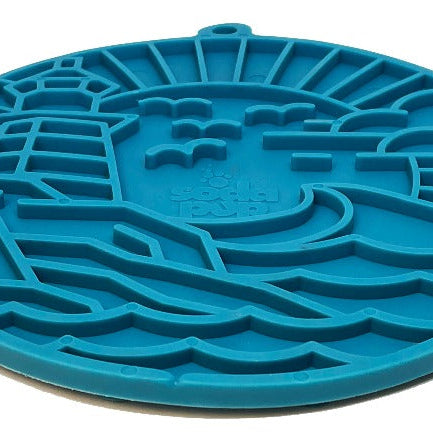 Blue Lighthouse EMAT enrichment lick mat with suction cups by SodaPup/True Dogs, LLC, designed for interactive dog enrichment.