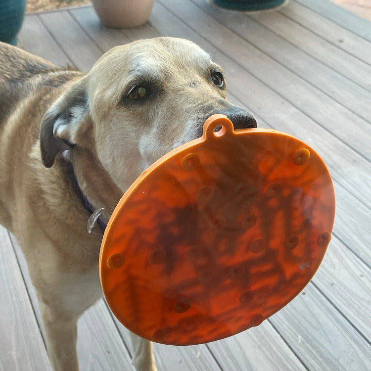 Orange SodaPup EMAT Camp eMat enrichment lick mat for dogs, designed for interactive and mental stimulation during playtime.