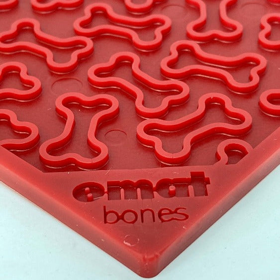 Purple Bones Design eMat Enrichment Lick Mat for dogs by SodaPup/True Dogs, LLC, featuring a bone pattern for interactive fun.