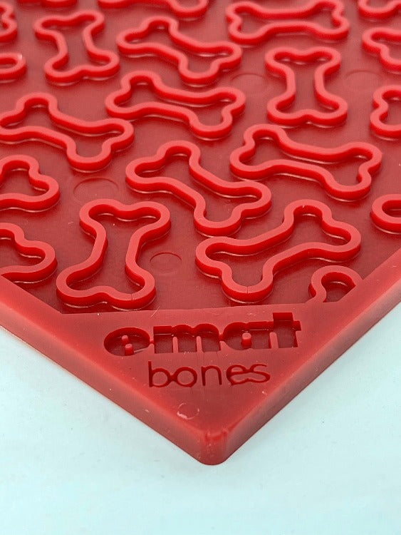 Purple Bones Design eMat Enrichment Lick Mat for dogs by SodaPup/True Dogs, LLC, featuring a bone pattern for interactive fun.