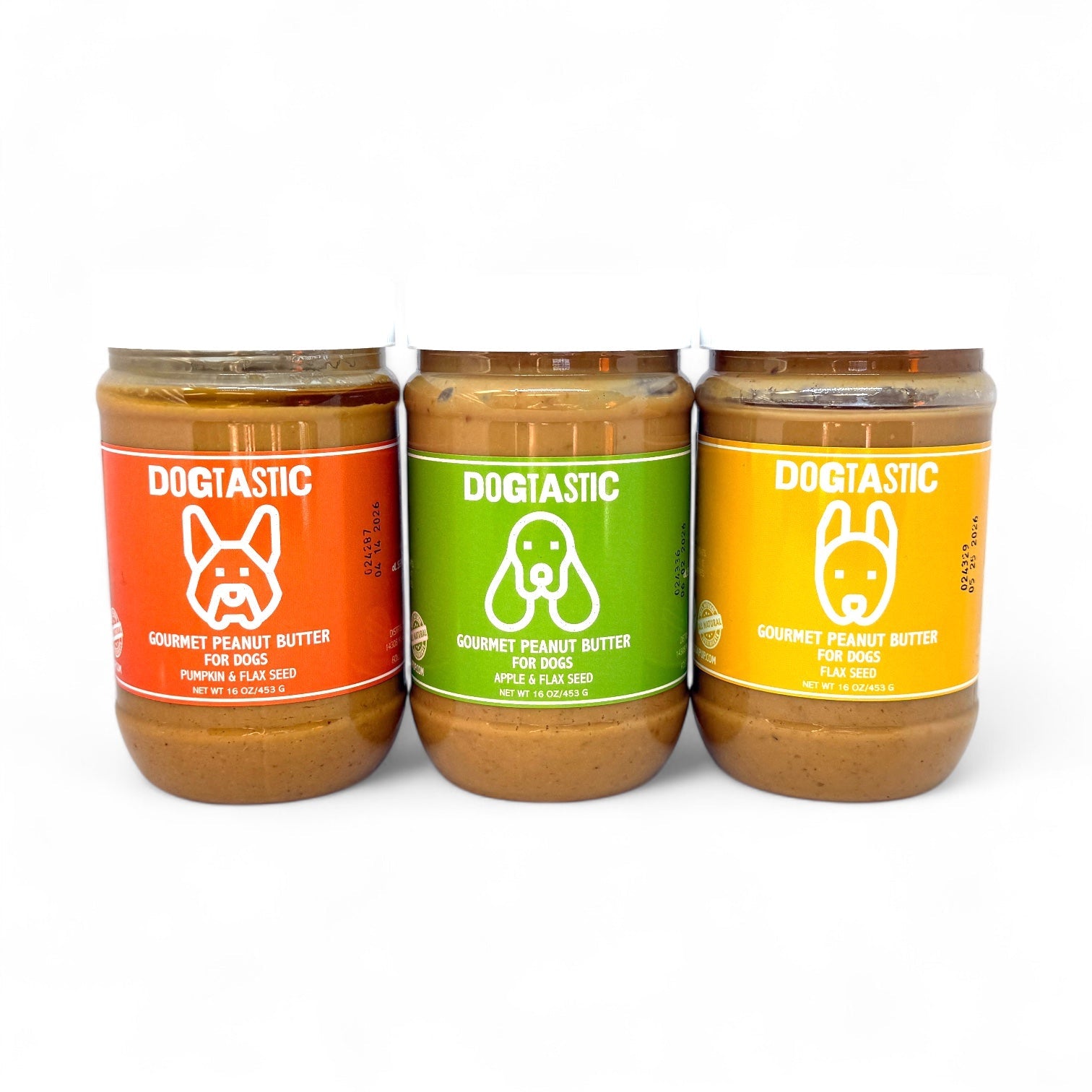 Dogtastic Gourmet Peanut Butter for Dogs by SodaPup, Apple and Flax flavor, in a jar with a dog treat on a table.