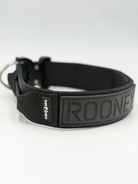 Titan Tactical Elite Dog Collar featuring 1.75" Mil-Spec Type 13 nylon webbing, a genuine AustriAlpin COBRA® Integrated D-Ring Buckle, RuffLock Retained Handle System, and the exclusive RuffTag Personalized BioThane Identification System. Handmade in the USA by American Ruffneck Collars. Side view of Rufflock Retaining System. 