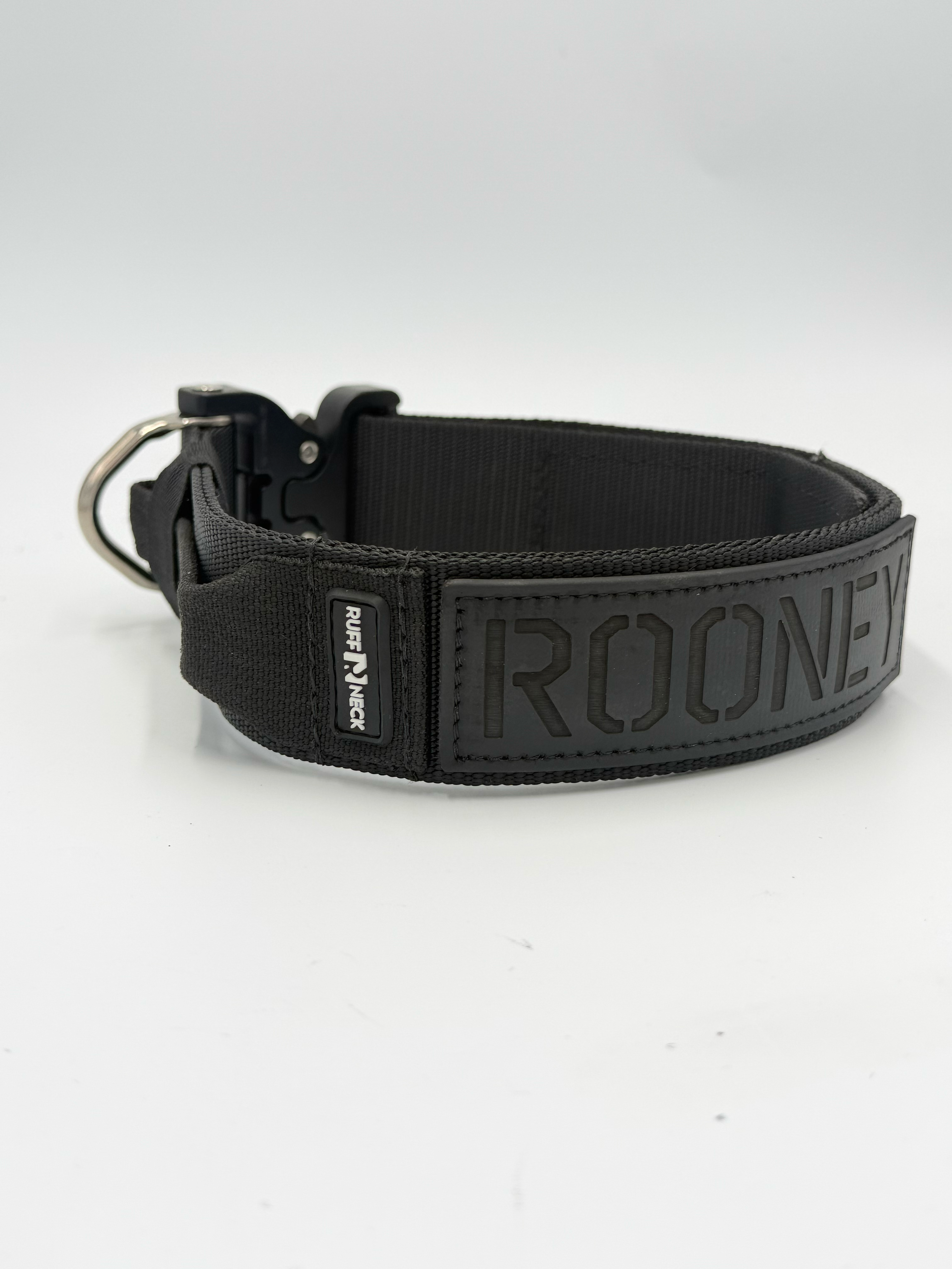 Titan Tactical Elite Dog Collar featuring 1.75" Mil-Spec Type 13 nylon webbing, a genuine AustriAlpin COBRA® Integrated D-Ring Buckle, RuffLock Retained Handle System, and the exclusive RuffTag Personalized BioThane Identification System. Handmade in the USA by American Ruffneck Collars. Side view