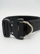 Titan Tactical Elite Dog Collar featuring 1.75" Mil-Spec Type 13 nylon webbing, a genuine AustriAlpin COBRA® Integrated D-Ring Buckle, RuffLock Retained Handle System, and the exclusive RuffTag Personalized BioThane Identification System. Handmade in the USA by American Ruffneck Collars. Buckle close-up. 