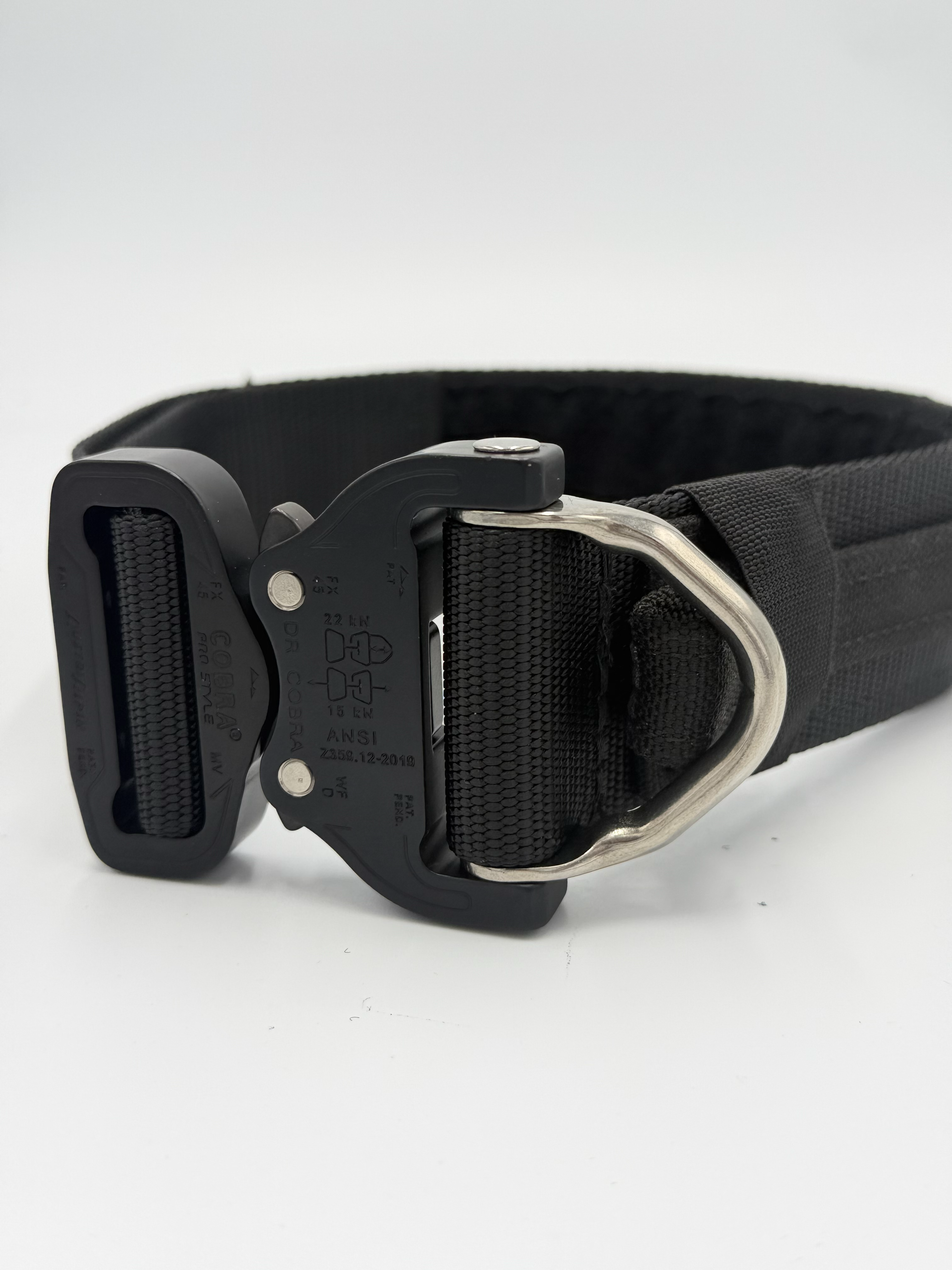 Titan Tactical Elite Dog Collar featuring 1.75" Mil-Spec Type 13 nylon webbing, a genuine AustriAlpin COBRA® Integrated D-Ring Buckle, RuffLock Retained Handle System, and the exclusive RuffTag Personalized BioThane Identification System. Handmade in the USA by American Ruffneck Collars. Buckle close-up. 