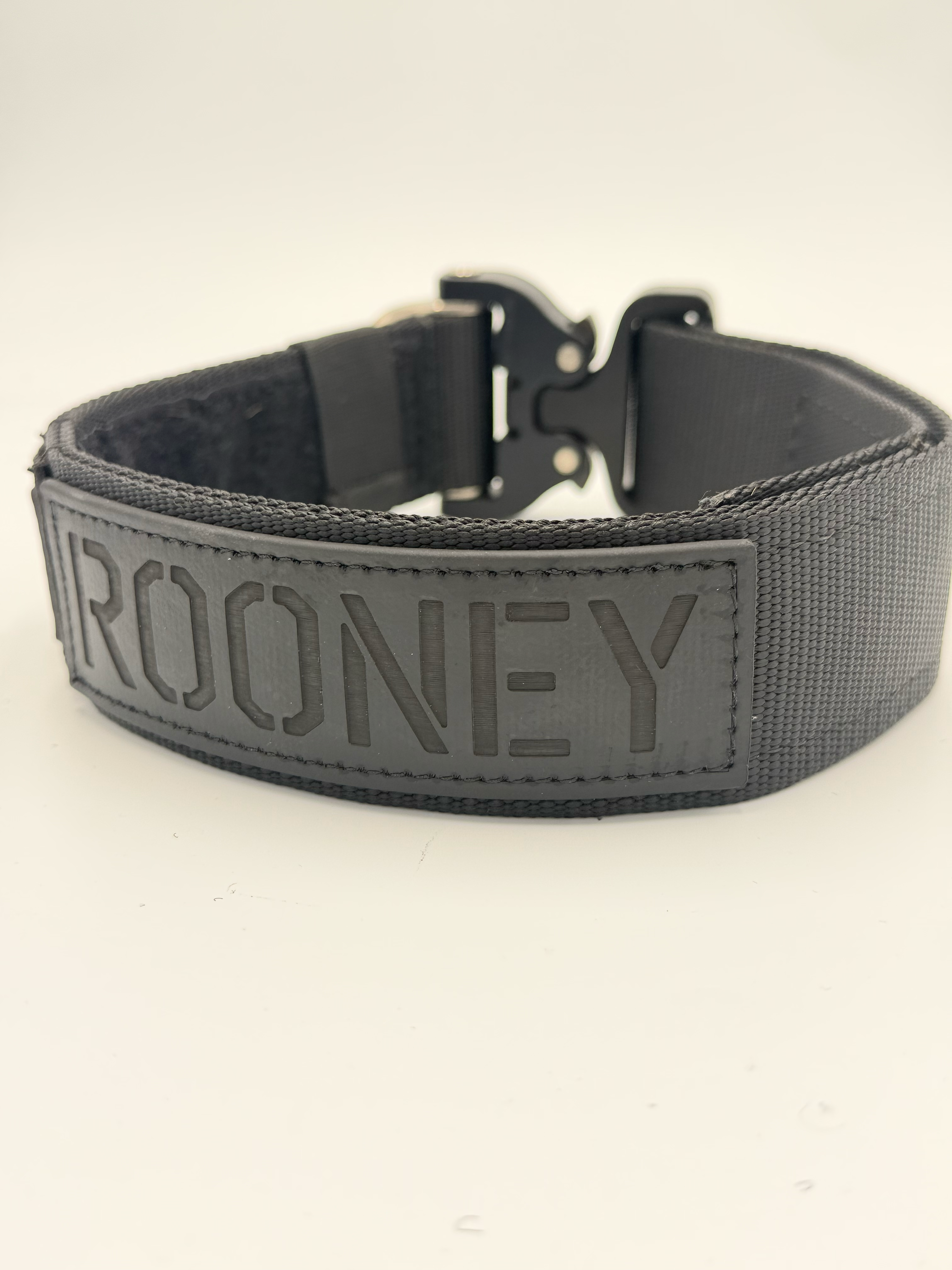 Titan Tactical Elite Dog Collar featuring 1.75" Mil-Spec Type 13 nylon webbing, a genuine AustriAlpin COBRA® Integrated D-Ring Buckle, RuffLock Retained Handle System, and the exclusive RuffTag Personalized BioThane Identification System. Handmade in the USA by American Ruffneck Collars. Rear view.