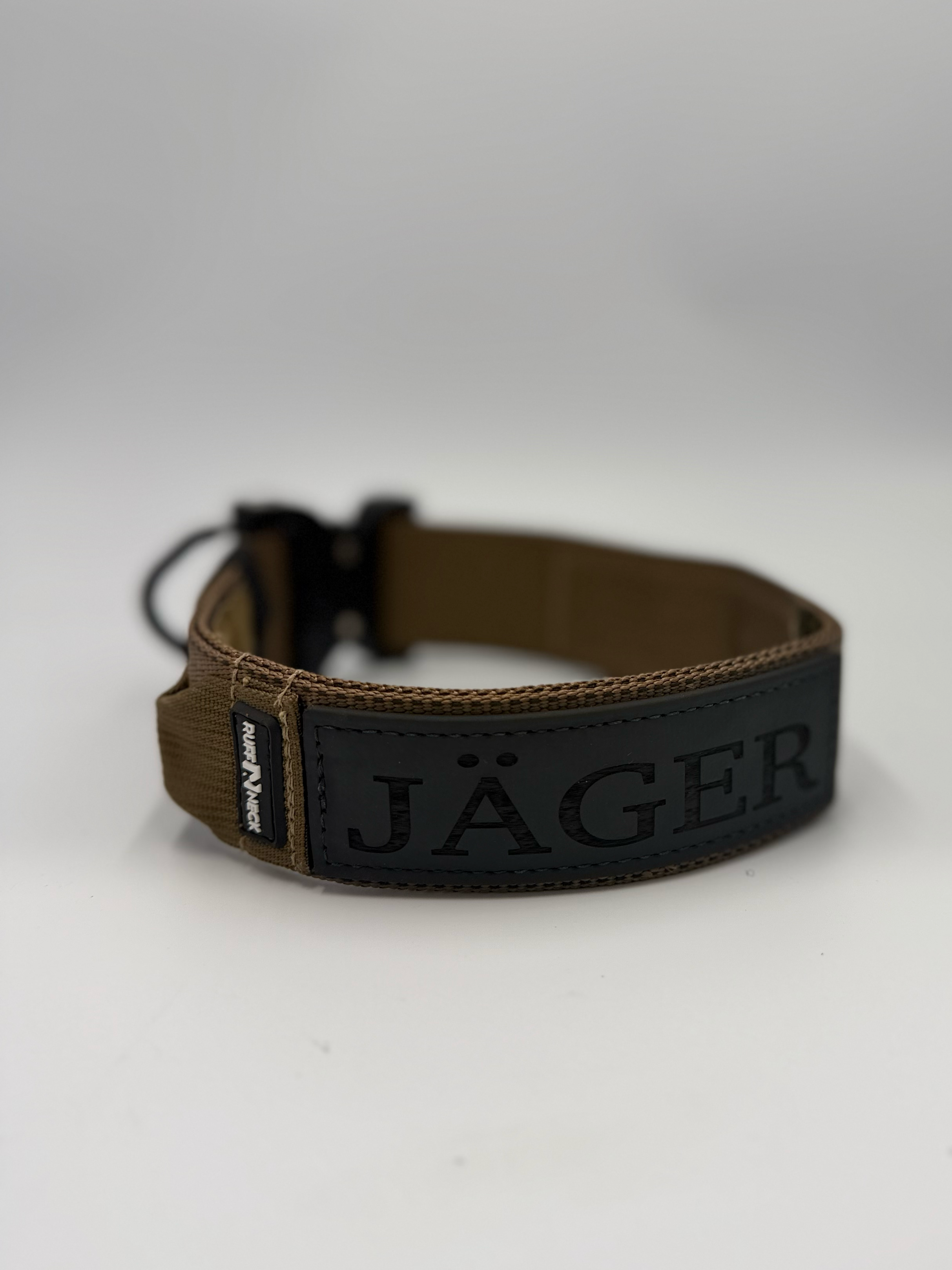 Titan Tactical Elite Dog Collar featuring 1.75" Mil-Spec Type 13 nylon webbing, a genuine AustriAlpin COBRA® Integrated D-Ring Buckle, RuffLock Retained Handle System, and the exclusive RuffTag Personalized BioThane Identification System. Handmade in the USA by American Ruffneck Collars. Clean level rear view of Rufftag. 