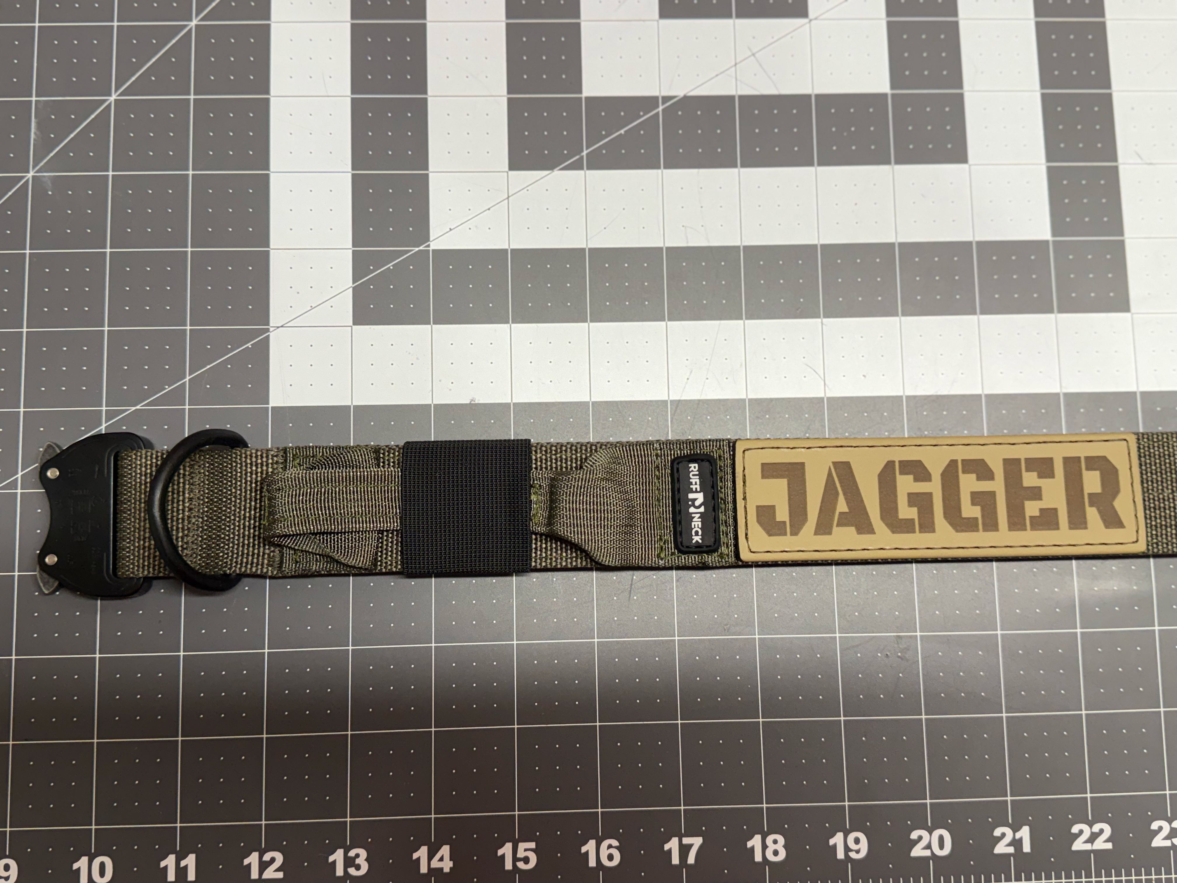 Titan Tactical Dog Collar featuring 1.5" Mil-Spec 4015 nylon webbing, a genuine AustriAlpin COBRA® buckle, RuffLock Retained Handle System, and the exclusive RuffTag Personalized BioThane Identification System. Handmade in the USA by American Ruffneck Collars. Opened up, lying flat. 
