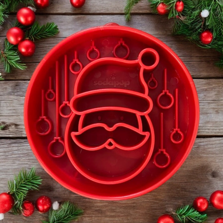 Red Santa design eBowl for dogs by SodaPup, featuring Santa-themed enrichment slow feeder bowl with festive holiday pattern.