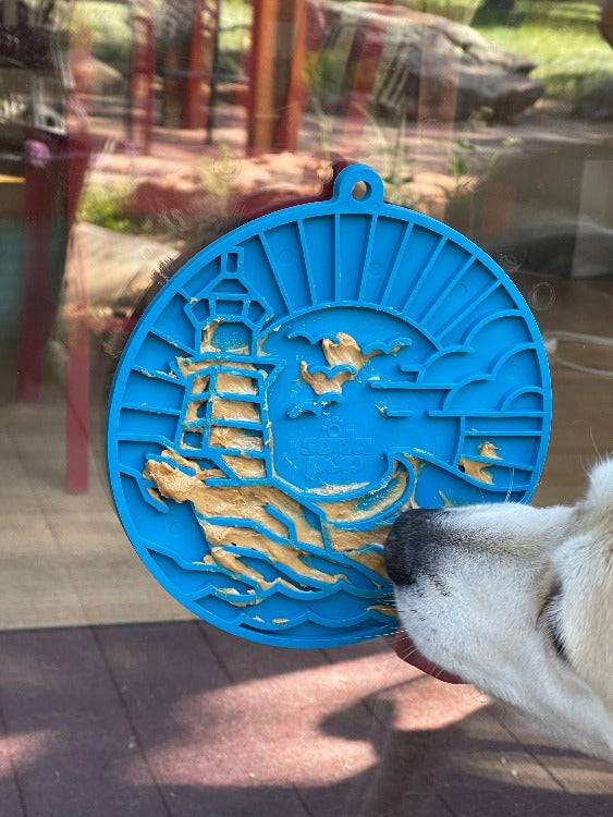 Sea foam blue Lighthouse eMat Enrichment Lick Mat with suction cups from SodaPup/True Dogs, designed for dog enrichment.