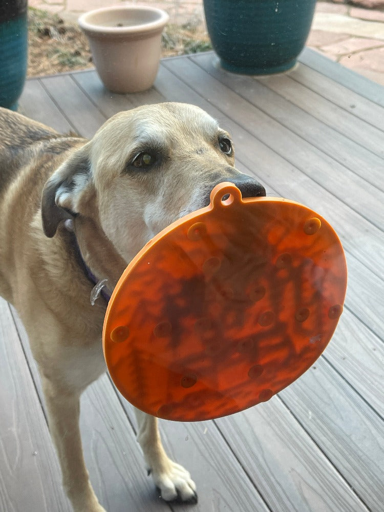 Orange SodaPup EMAT Camp eMat enrichment lick mat for dogs, designed for interactive and mental stimulation during playtime.