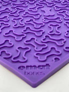 Purple Bones Design eMat Enrichment Lick Mat by SodaPup for dogs, featuring a bone pattern on a durable silicone surface.
